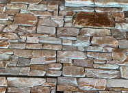 Textured natural split-face stack stone wall cladding panels in warm earthy and cream tones for Melbourne homes